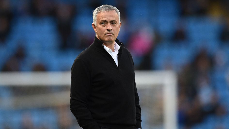 Jose Mourinho checks out the pitch at the Etihad Stadium