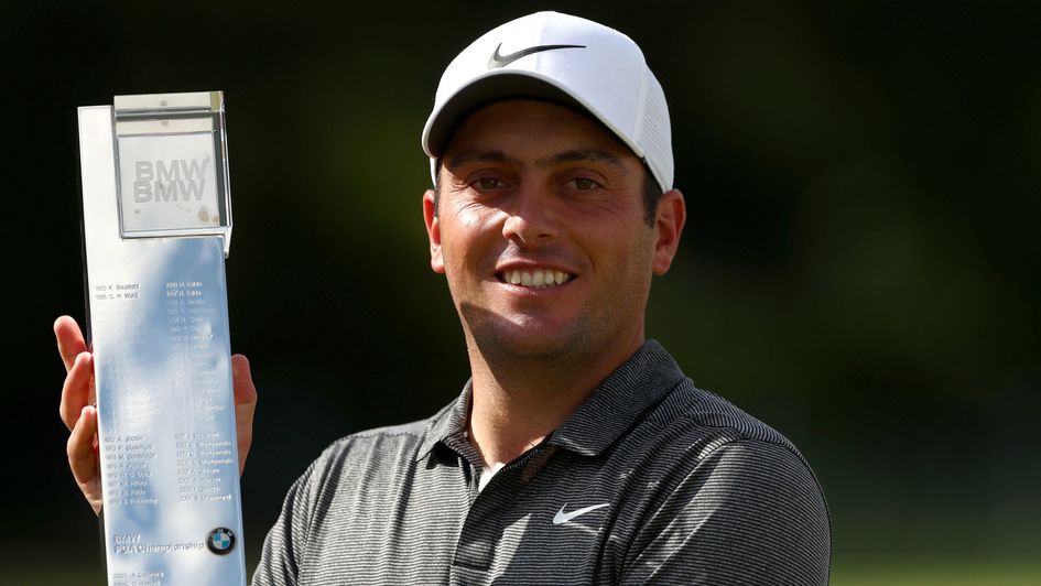 Francesco Molinari celebrates with the trophy
