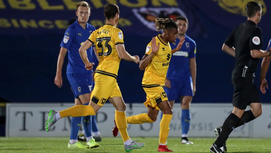 David Kasumu celebrates his goal against AFC Wimbledon
