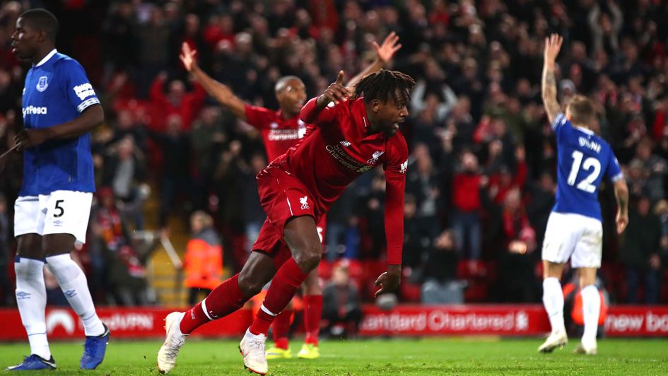 Divock Origi celebrates scoring for Liverpool against Everton