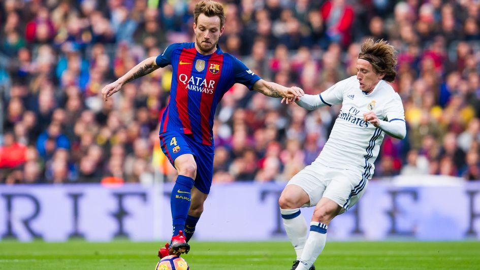 Croatia team-mates Ivan Rakitic and Luka Modric do battle during El Clasico