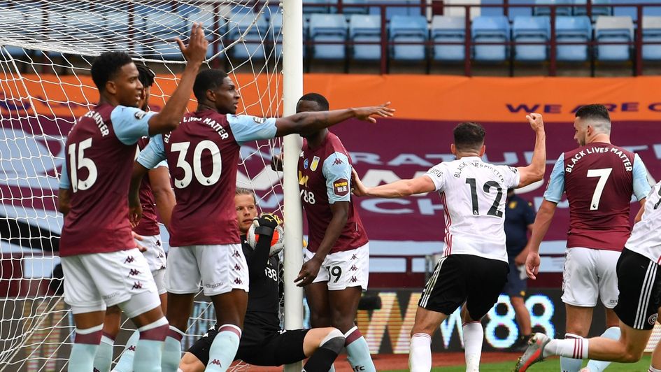 Aston Villa's Orjan Nyland carries the ball over the line against Sheffield United but the Hawk Eye system fails to award a goal