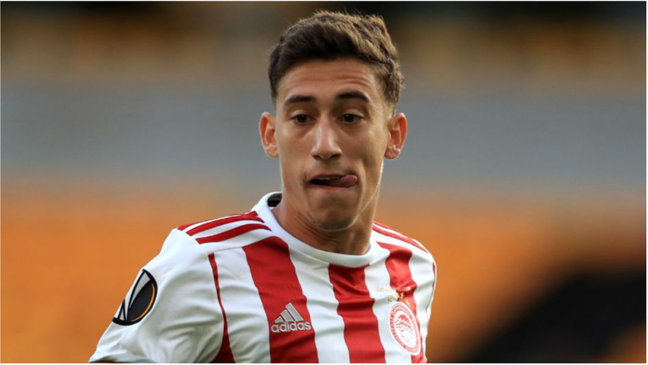 Olympiacos left back Kostas Tsimikas is heading to Liverpool to sign for the Premier League champions