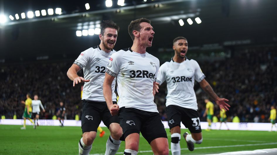 Craig Bryson (centre) celebrates after scoring against Norwich