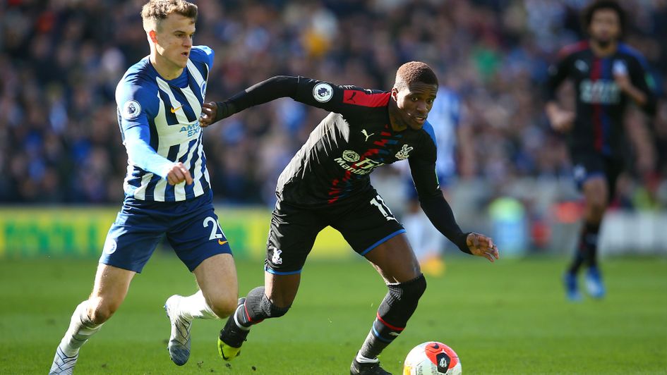 Wilfried Zaha of Crystal Palace is closed down by Brighton's Solomon March