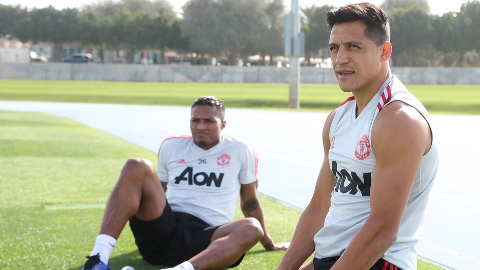 Antonio Valencia and Alexis Sanchez take a break