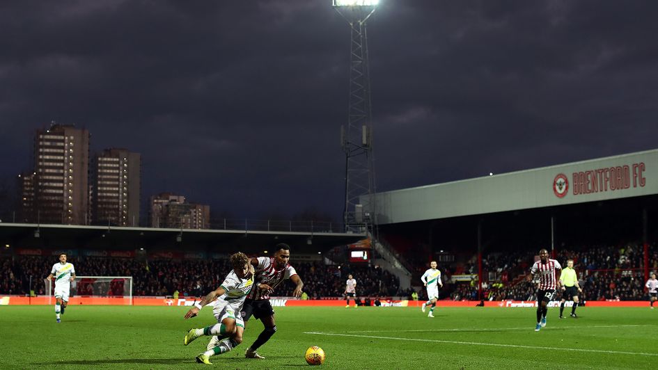 Rico Henry and Onel Hernandez battle for the ball