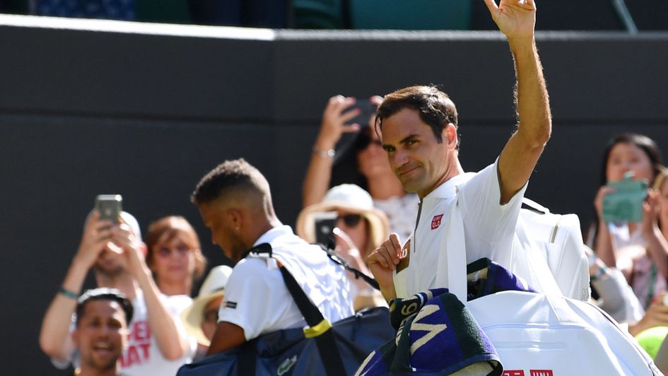 Roger Federer waves to his fans at Wimbledon