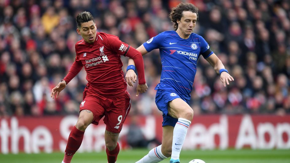 Roberto Firmino (left) and David Luiz battle for the ball