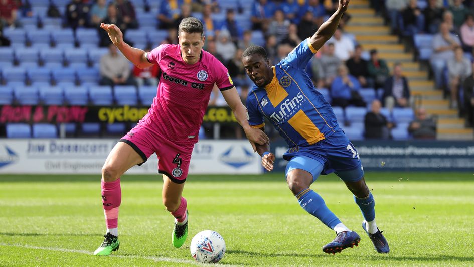 Jim McNulty (left) battles for the ball