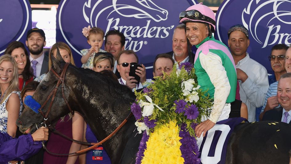 Mike Smith celebrates on Arrogate after last year's Classic victory