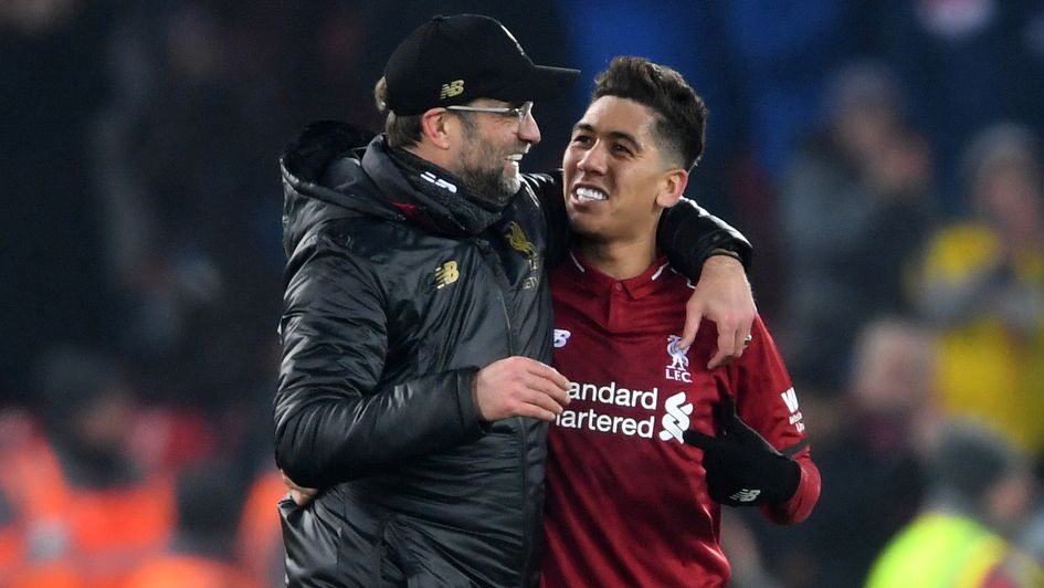 Jurgen Klopp embraces Roberto Firmino