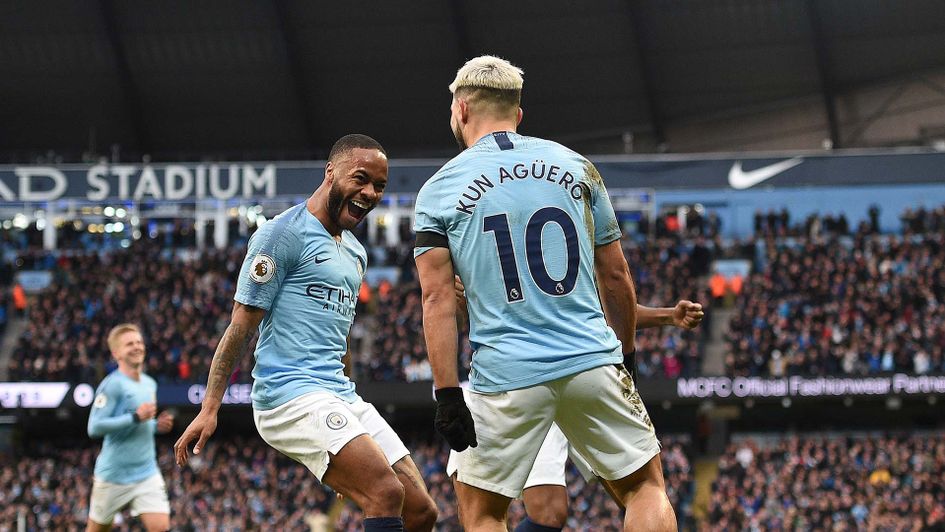 Sergio Aguero celebrates with Raheem Sterling for Manchester City