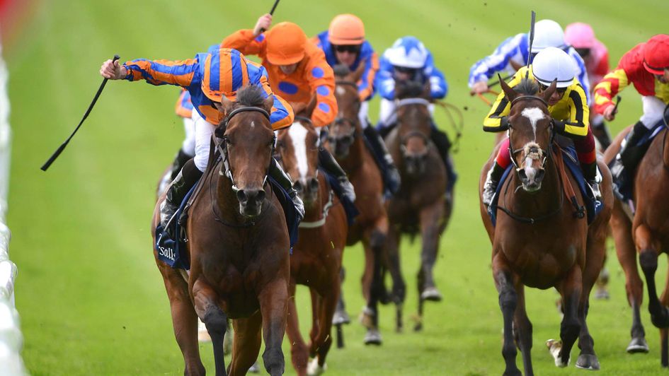 Hermosa and Ryan Moore (left) win the Group 1 Tattersalls Irish 1,000 Guineas