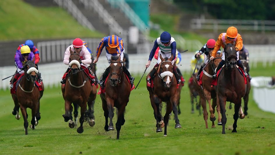 Cleveland (orange and blue silks) wins the Chester Cup from Coltrane